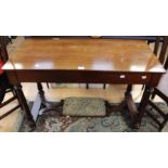 A late Victorian mahogany ladies desk with footrest.