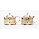 A pair of silver mustard pots, London 1935/36,