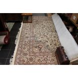 A Persian Carpet, with foliage decoration on a cream ground, hand knotted, approx 4m x 3.