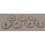 Seven Chelsea ware late 19th Century hand painted dessert plates (7)