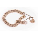 A rose gold curb bracelet with textured links, padlock clasp, with attached Humber car charm,