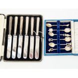 A set of boxed filled silver handled tea knives,