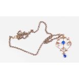 An Edwardian 9ct gold open work pendant set with blue paste stones, length approx 48mm,