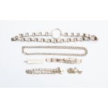 A Victorian white metal chain, along with a silver Ingot, three bracelets and a white metal chain,