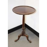 A wine table early 19th Century ball and clamfeet reeded stand,