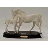 A Royal Doulton "Spirit of Affection" white horse and foal figure group,