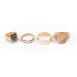 A collection of gold rings rings including a Gent's 18ct gold hematite intaglio seal ring,
