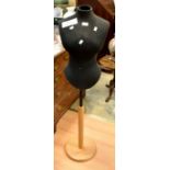 A tailor's dummy, in black,