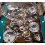 A box of silver plated items to include teapots jugs etc, and a large tray,