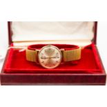 A 1960s 9ct gold, hallmarked, gents Longines manual wristwatch, champagne dial, batons and numbers,