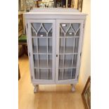 A mid 20th Century white painted display cabinet