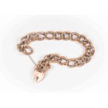 A 9ct rose gold curb bracelet A/F, padlock fastening, weight approx 25.