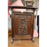 An ornate carved oak fire screen, width approx 46cm,