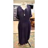 A 1940's blue crepe rayon dress with over stitched front bust area, darted (swing) skirt to back,