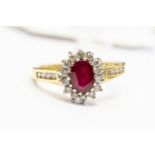 A ruby and diamond cluster ring, the ruby weight approx 0.