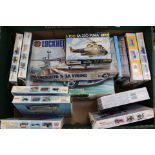 A selection of thirteen plastic model kits, all appear to be unmade,