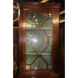 A 19th Century mahogany glazed wall hanging corner cupboard.