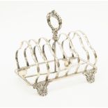 A Victorian silver plated six tier toast rack, shell cast feet, cast handle,