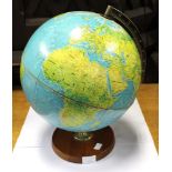 A 1970's globe on a wooden base,