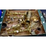 A box of brass and copper including candlesticks and an Indian brass plate