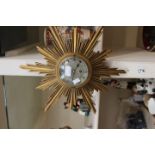 A 1950s Elliott gilt sunburst wall clock (key)