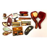 Collection of cased pipes, amber and silver trimmed,