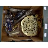 Collection of brass and flatware including trivets