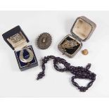Silver brooches, 19th Century wooden bead necklace,