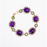 An amethyst and peridot bracelet, cantinille work surrounds,