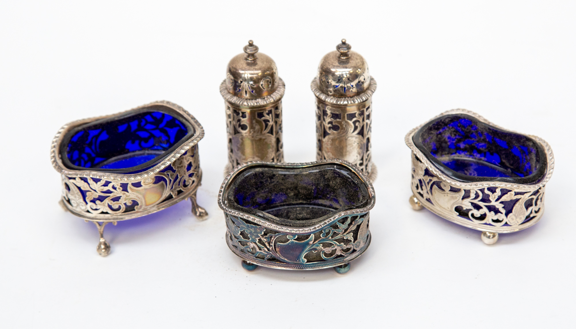 A matched set of three large silver salts and two pepperettes,