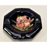 A Moorcroft African Lily pattern ashtray,