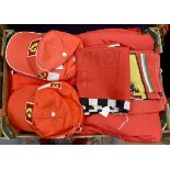A collection of official Ferrari memorabilia including one coat, eight caps, one shirt,