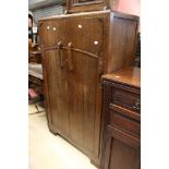 A 1950's oak tallboy.