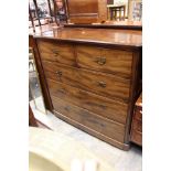 A large Victorian mahogany chest of drawers with two over three deep drawers all with metal handles,