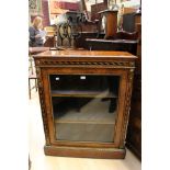 A Victorian walnut display cabinet with ormilou fittings.