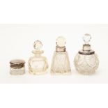Three silver mounted dressing table perfume bottles and small jar (4)