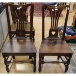 A George I set of six joined oak side chairs, with shaped and pierced back splats, plank seats,