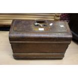 A late Edwardian to 1920's Singer sewing machine in wooden case,
