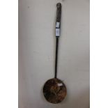 A 19th Century brass straining spoon,
