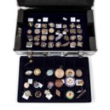 A metal coin case of watch fobs, lapel/pin badges, sweetheart brooches, contains 80 silver,