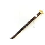 Edwardian era bamboo sword stick with carved ivory stylised pommel in the form of fist clutching a