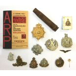 A collection of WW2 British cap badges etc to include Royal Engineers, RAOC, RA, Camerons,