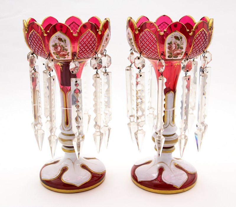 A pair of mid 19th Century ruby opaque cased glass lustres, circa 1860, ogee rims, florally