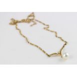 A Mikimoto gold, diamond and pearl pendent necklace, having 18ct. yellow gold 'v' shaped pendant set