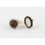 A 9ct. gold, garnet and opal cluster ring, the mount set round cut garnet to centre surrounded two