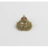 Royal Navy Interest: A 9ct. gold and red enamel Royal Navy crown and anchor badge, verso