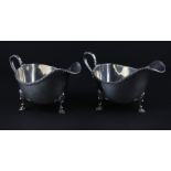 A pair of silver sauce boats, by Walker & Hall, assayed Sheffield 1939, of traditional form, each