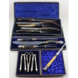 A three piece silver plated nut cracker and grape scissor set, in felt lined fitted case, together