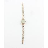 A 9ct. gold ladies' bracelet watch, manual movement signed Bentima Star, having silvered rectangular