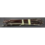 A collection of antique violin bows